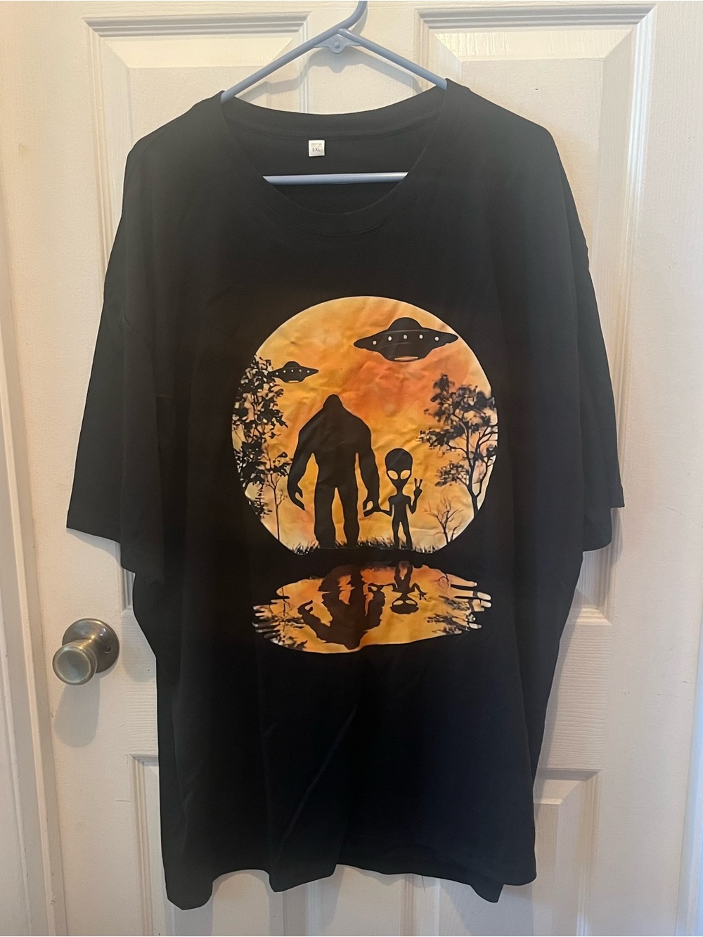 Black Graphic Tee with Orange Alien Sunset Print